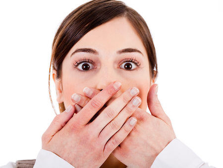 dentist patient model covering her mouth