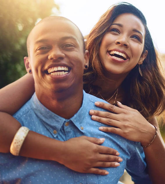 root canal patient models smiling and hugging