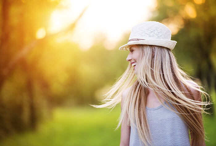 Six Month Smiles patient model in a white hat