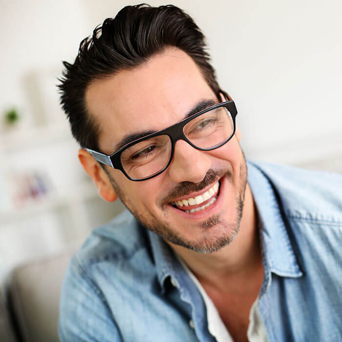 full mouth reconstruction patient model in glasses